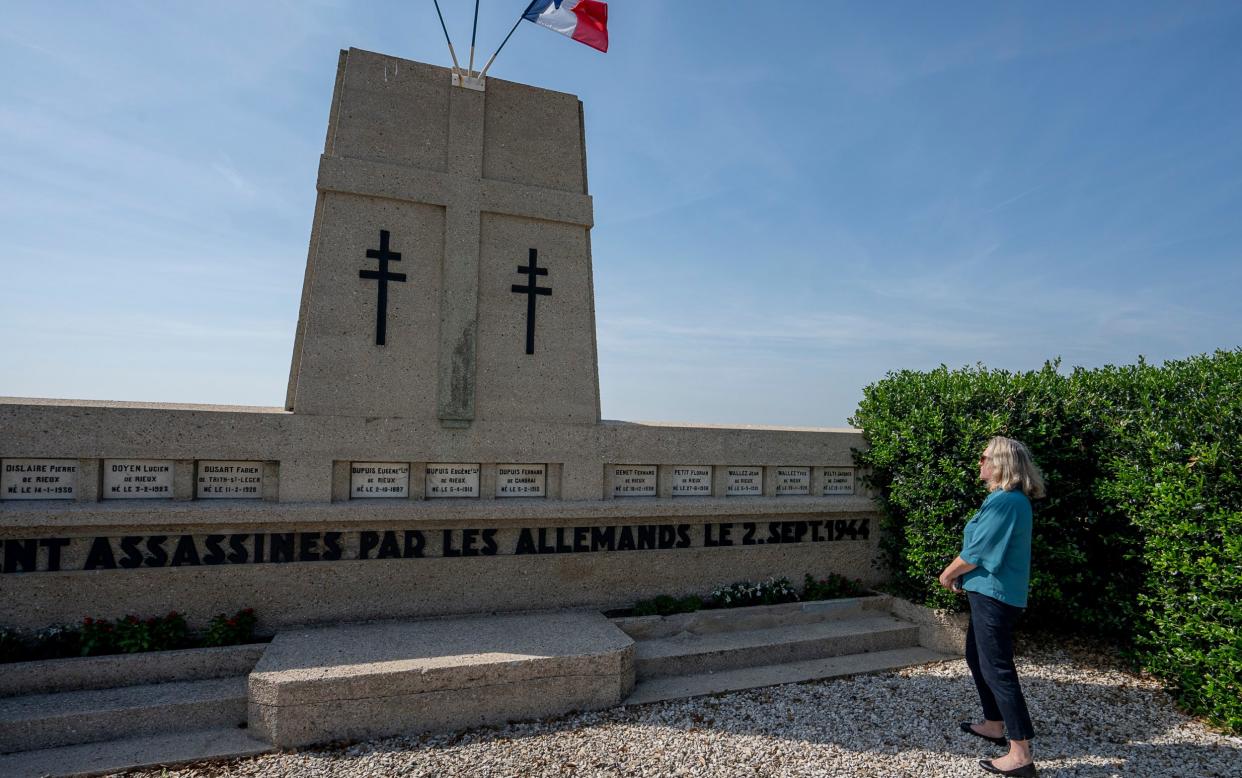 Marina Gask meditates on the monument in memory of the 13 victims