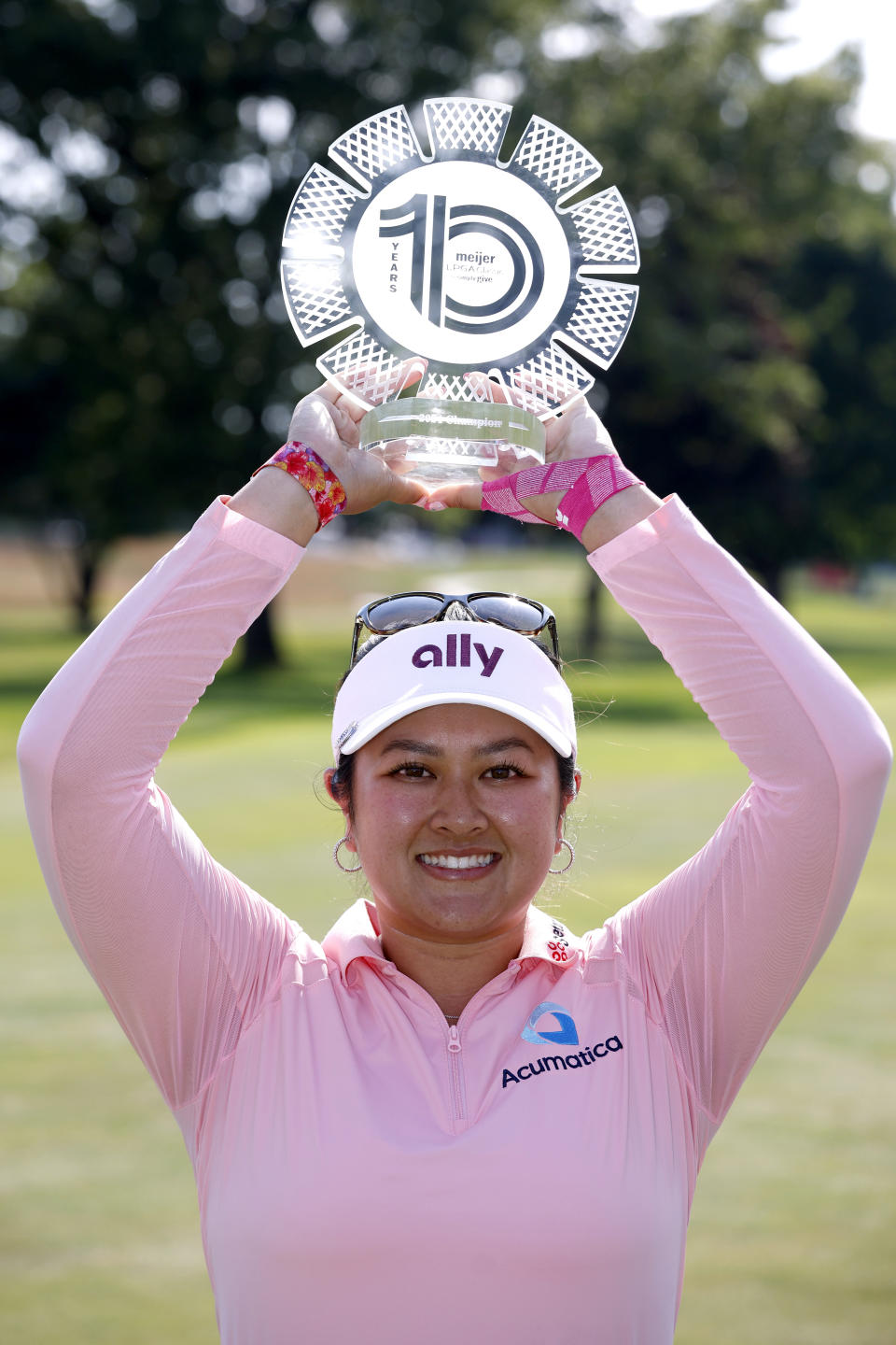 Lilia Vu holds the trophy after winning the Meijer LPGA Classic golf tournament, Sunday, June 16, 2024, in Belmont, Mich. (AP Photo/Al Goldis)