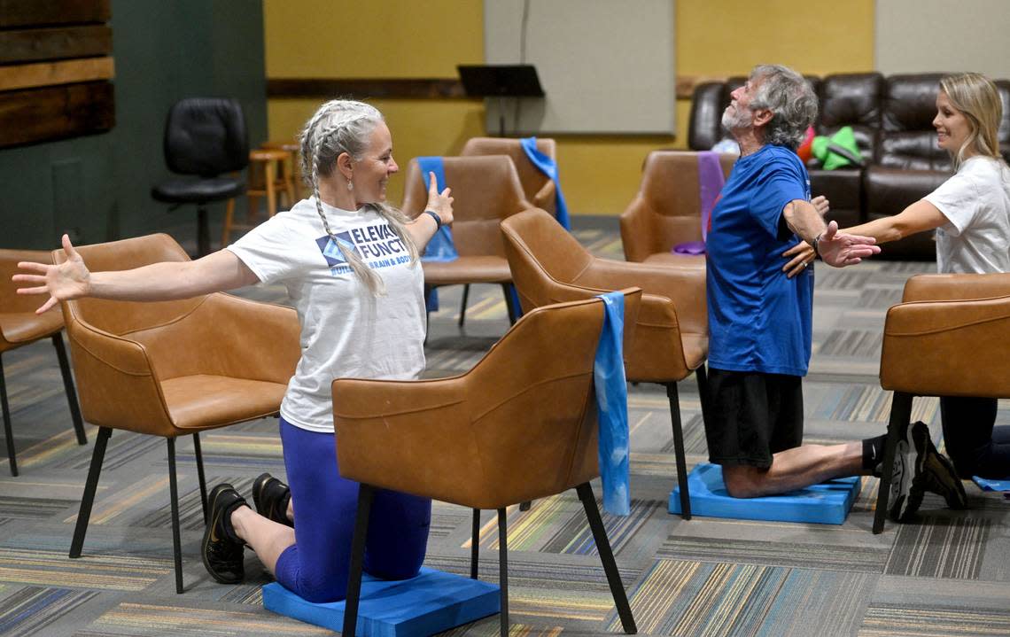 Danielle DuVall leads a set of stretching and balance exercises during an Elevated Function class on Tuesday, July 9, 2024 at Calvary Church.