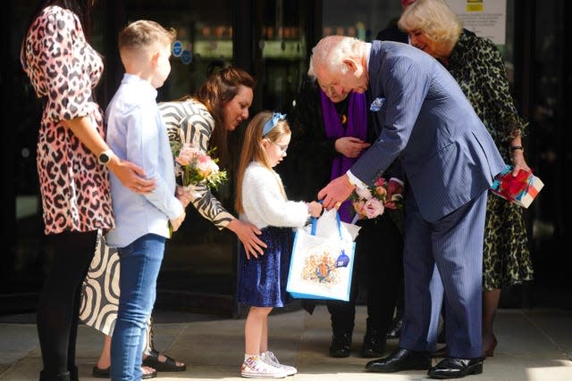 The King is presented with a bouquet following a visit to University College Hospital Macmillan Cancer Centre 