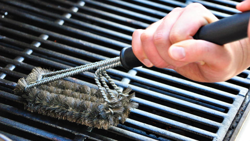 Grates being cleaned with a metal brush