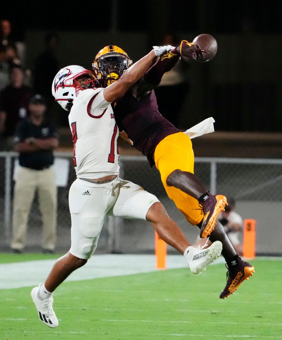 Arizona State Sun Devils defensive back Demetries Ford (4) knocks the pass away from Southern Utah Thunderbirds wide receiver Zack Mitchell (14) in the first half at Mountain America Stadium in Tempe on Aug. 31, 2023.