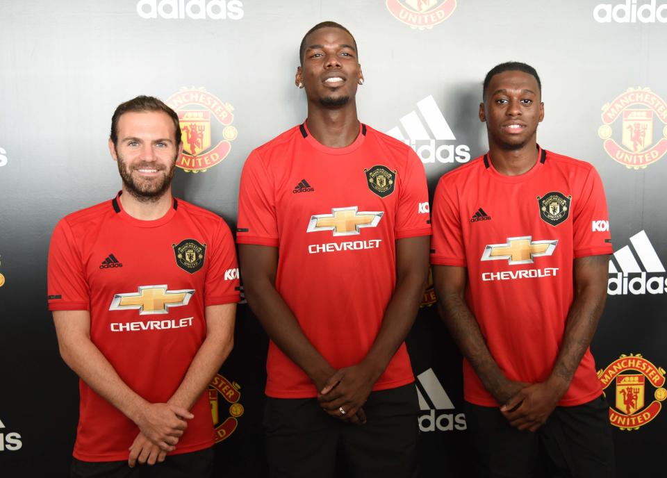 (From left) Manchester United's Juan Mata, Paul Pogba and Aaron Wan-Bissaka attending a fans' meet-and-greet event by adidas at The Float@Marina Bay. (PHOTO: Zainal Yahya/Yahoo News Singapore)