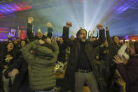 Pristina's mayor Perparim Rama celebrates with hundreds of Swiss fans after scoring during the World Cup group G soccer match between Serbia and Switzerland in a fan zone in the capital Pristina, Kosovo, Friday Dec. 2, 2022. (AP Photo/Visar Kryeziu)