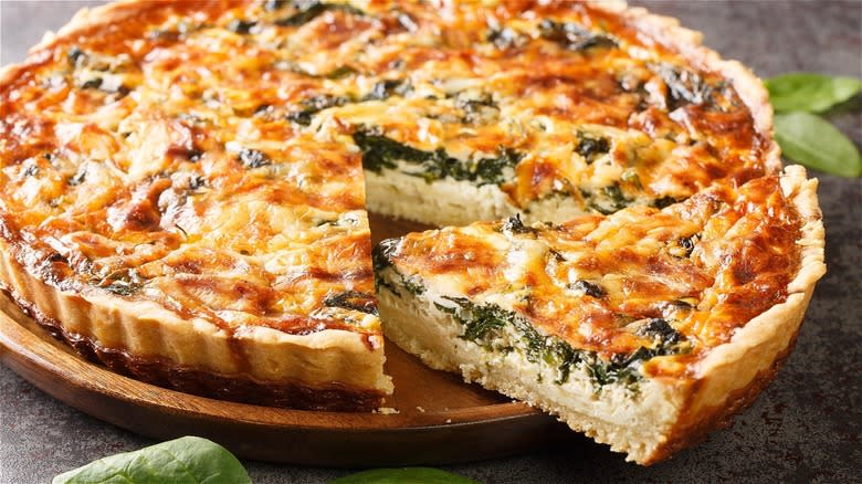 Quiche Florentine on wooden plate