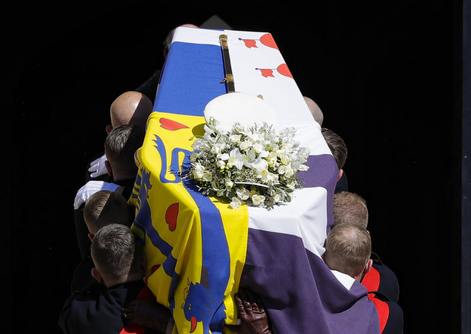 The coffin is carried inside the St George's Chapel for the funeral of Britain's Prince Philip inside Windsor Castle in Windsor, England, Saturday, April 17, 2021. (Kirsty Wigglesworth/Pool via AP)