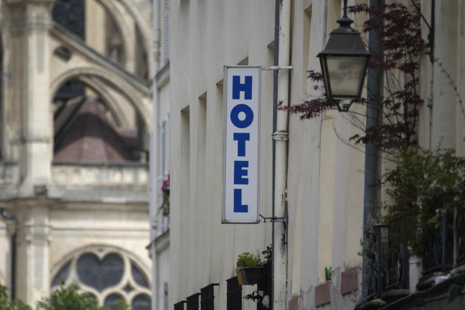 A sign advertising an hotel is pictured in Paris Thursday, July 20, 2023. Paris touted its large and diverse accommodation options – everything from campsites along the River Seine to some of the world's most famous luxury hotels – when it was bidding for the Games, boasting that it has "more than sufficient accommodation" to host France's first Summer Games in a century and millions of Olympic visitors. (AP Photo/Christophe Ena)