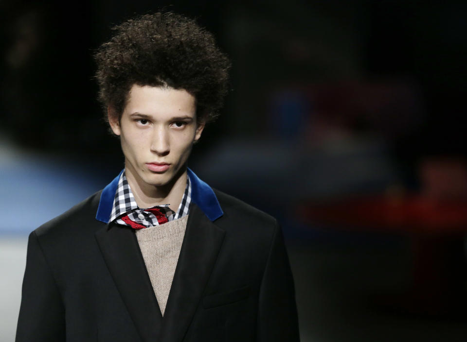 A model wears a creation for Prada men's Fall-Winter 2013-14 collection, part of the Milan Fashion Week, unveiled in Milan, Italy, Sunday, Jan. 13, 2013. (AP Photo/Antonio Calanni)