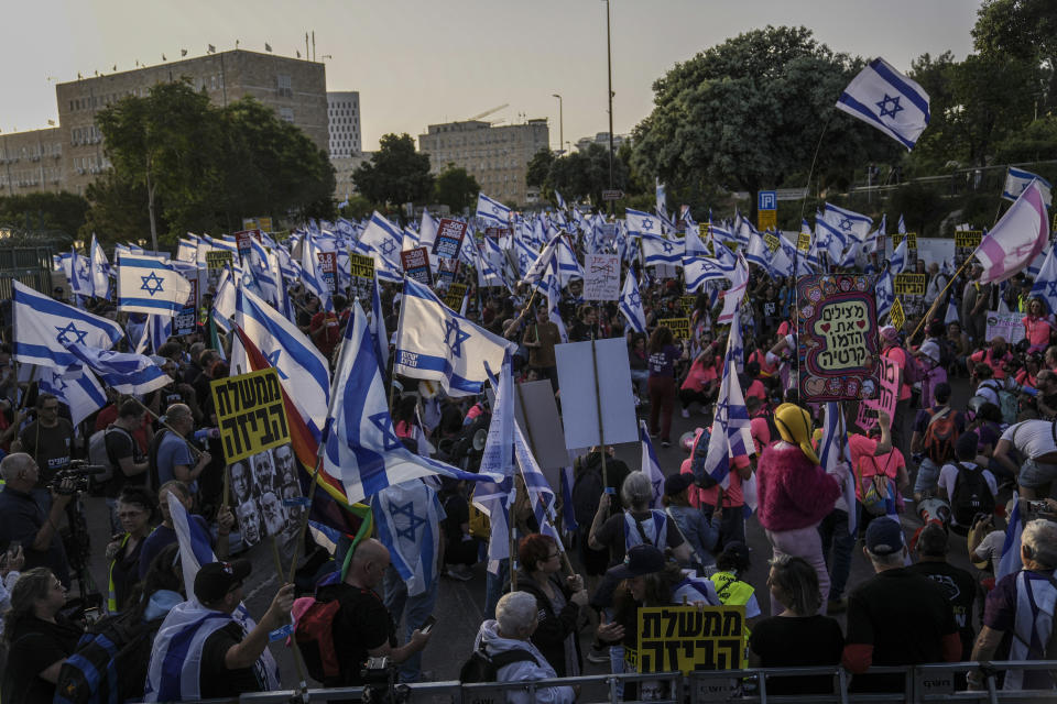 Israelis protest against a budget proposed by Prime Minister Benjamin Netanyahu's government ahead of a parliamentary vote and its plans to overhaul the country's judicial system in Jerusalem, Tuesday, May 23, 2023. (AP Photo/Mahmoud Illean)