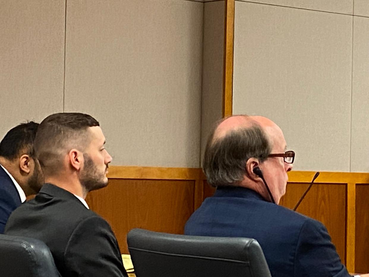 Dennis Putnam, left, sits with his lawyer, Buck Blankner.