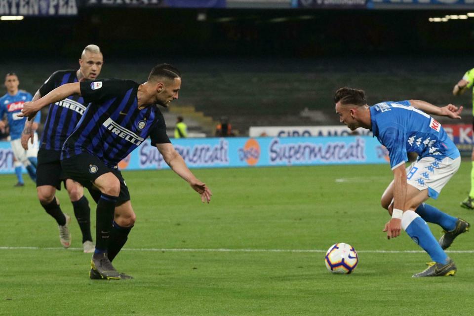 S.S.C. Napoli midfielder Fabian Ruiz, right, moves with the ball during a Serie A soccer match against Inter FC at the San Paolo stadium in Naples, Italy, Sunday, May 19, 2019. (Cesare Abbate/ANSA via AP)
