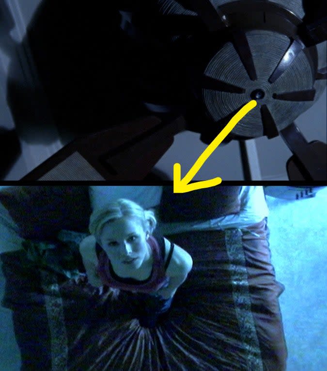 kristen bell as "veronica mars" stares at a hidden camera in a ceiling fan