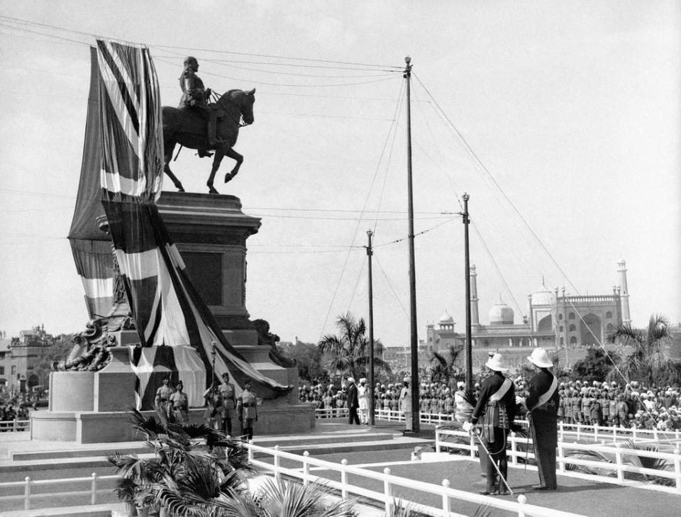 The prince at the unveiling ceremony of the King Edward VII Memorial in Delhi. By his side is the Viceroy of India, Lord Chelmsford (PA)