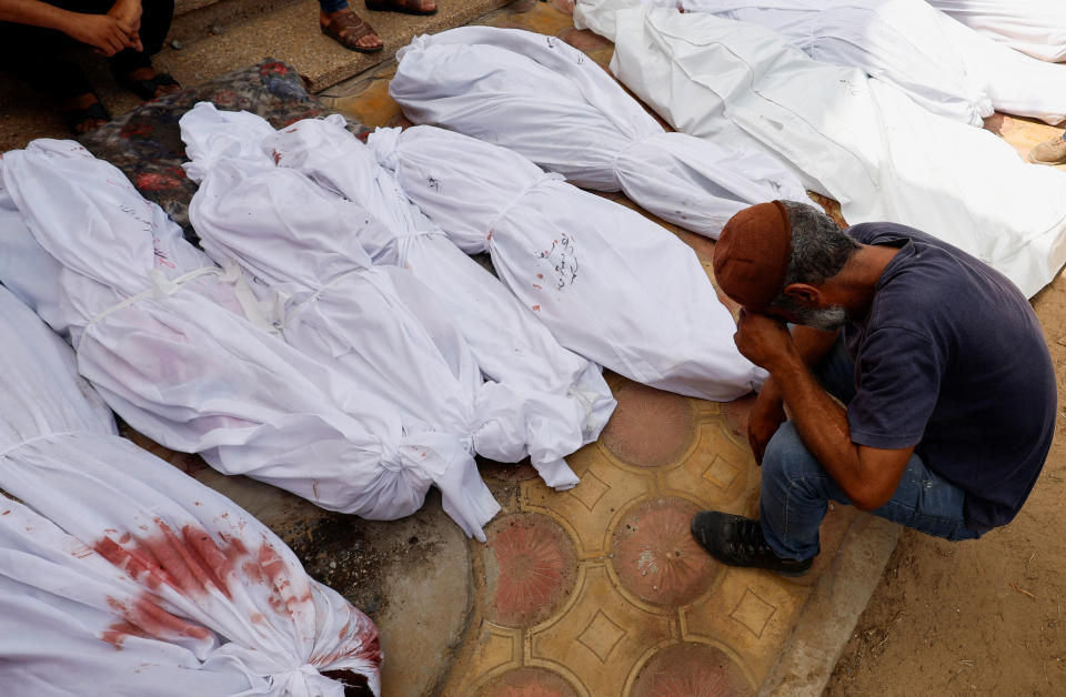 The bodies of Palestinians killed in Israeli strikes lie in a hospital in Khan Younis.