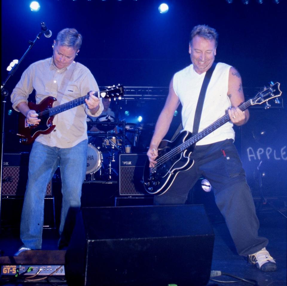 Bernard Sumner and Peter Hook on stage with New Order in 2001 - Getty