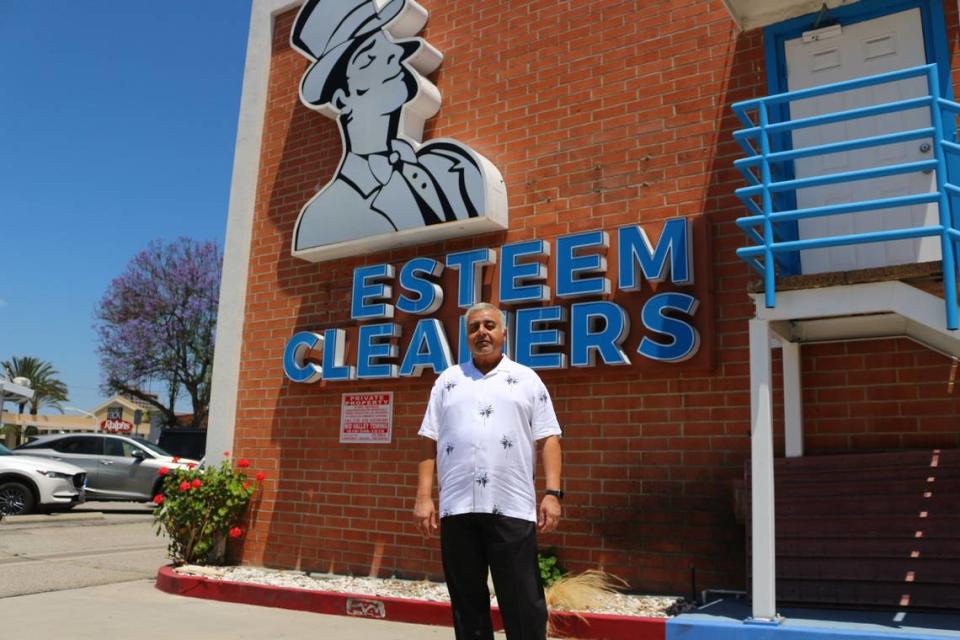 Ray Rangwala stands in front of his dry cleaners, Esteem Cleaners, in Glendale, California, on June 20, 2023.