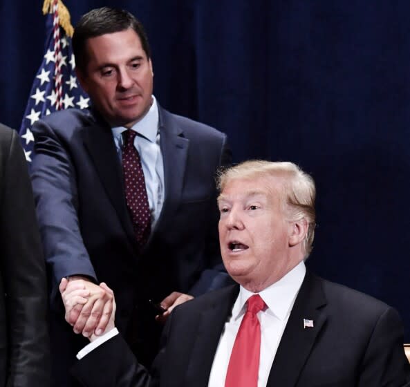 Former President Donald Trump shakes hands with Rep. Devin Nunes (R-CA) in 2018. (Photo by Nicholas Kamm / AFP via Getty)
