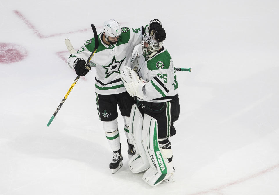 Dallas Stars' Alexander Radulov (47) and goalie Anton Khudobin (35) celebrate their 1-0 win over the Vegas Golden Knights after an NHL Western Conference final playoff hockey game, in Edmonton, Alberta, Sunday, Sept. 6, 2020. (Jason Franson/The Canadian Press via AP)