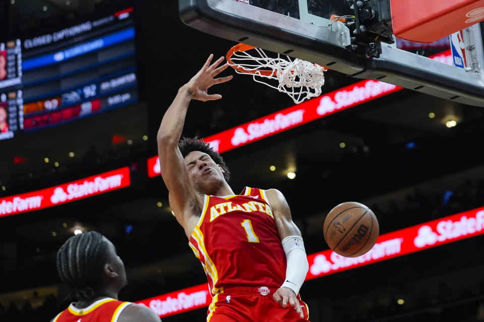 Atlanta Hawks forward Jalen Johnson (1) scores in the second half of an NBA basketball game against the Toronto Raptors Sunday, Jan. 28, 2024, in Atlanta. (AP Photo/John Bazemore)