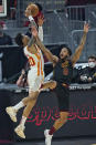 Cleveland Cavaliers' Lamar Stevens (8) and Atlanta Hawks' John Collins (20) battle for a loose ball in the first half of an NBA basketball game, Tuesday, Feb. 23, 2021, in Cleveland. Stevens was called for the foul. (AP Photo/Tony Dejak)