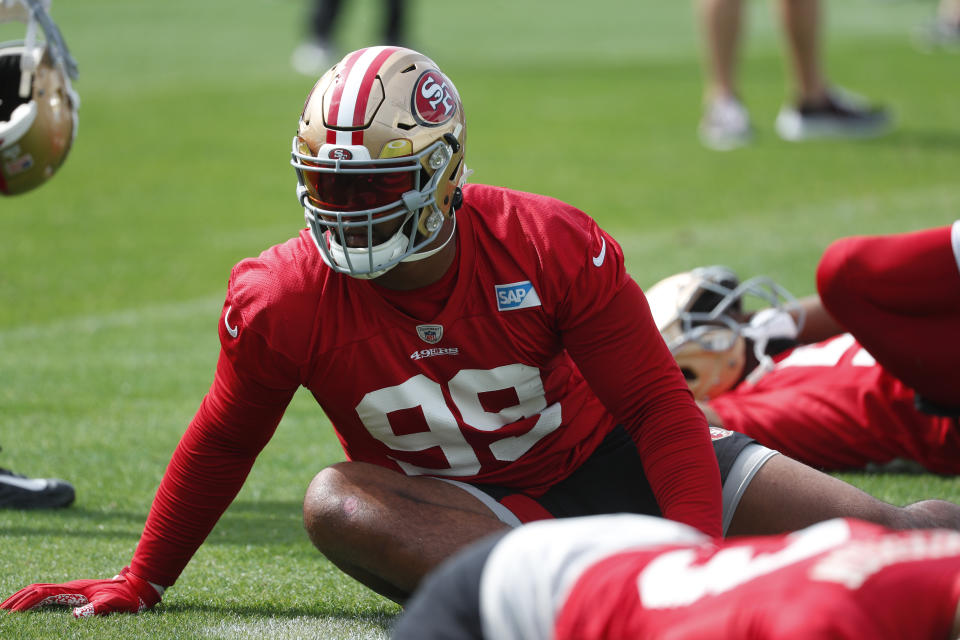 San Francisco 49ers defensive tackle DeForest Buckner stretches during practice for the NFL Super Bowl 54 football game, Friday, Jan. 31, 2020, in Coral Gables, Fla. (AP Photo/Wilfredo Lee)