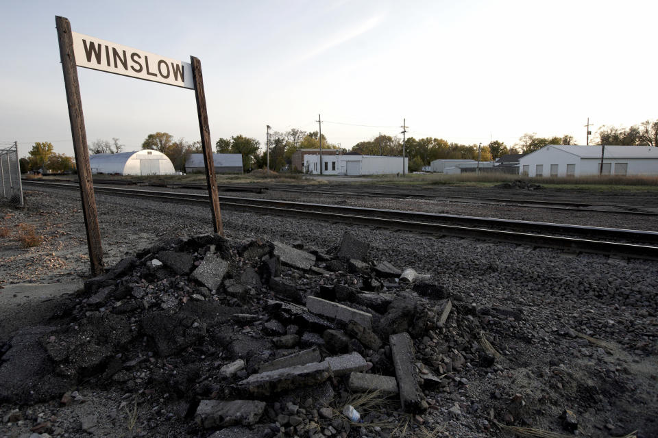 In this Oct. 24, 2019 photo, train tracks run through Winslow, Neb. It took only minutes for swift-moving floods from the Elkhorn River to ravage tiny Winslow this spring, leaving nearly all its 48 homes and businesses uninhabitable. Now, the couple dozen residents still determined to call the place home are facing a new challenge: Moving the entire town several miles away to higher ground. (AP Photo/Nati Harnik)