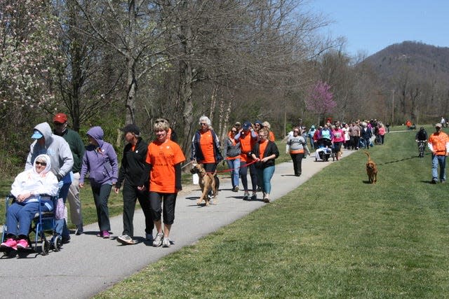 Walkers participate in a past Fletcher MS Walk at Bill Moore Community Park.