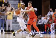 Auburn's Walker Kessler, right, tries to steal the ball from Missouri's Jarron Coleman, left, during the first half of an NCAA college basketball game Tuesday, Jan. 25, 2022, in Columbia, Mo. (AP Photo/L.G. Patterson)