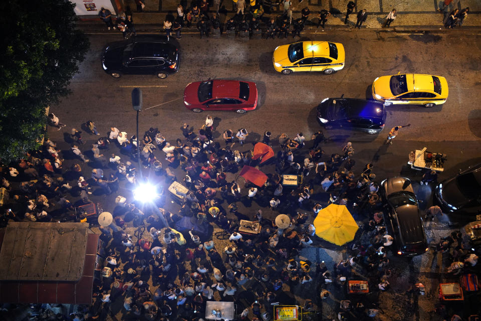 Supporters gather in front of the headquarters of the Brazilian Press Association, known as ABI, during a protest in support of the journalist Glenn Greenwald, in Rio de Janeiro, Brazil, Tuesday, July 30 , 2019. Brazil's president has raised the possibility of jail for Greenwald a few days after members of his party said the American's Brazil-based internet publication was "aligned with criminal hackers" for reporting on hacked phone calls. (AP Photo/Ricardo Borges)