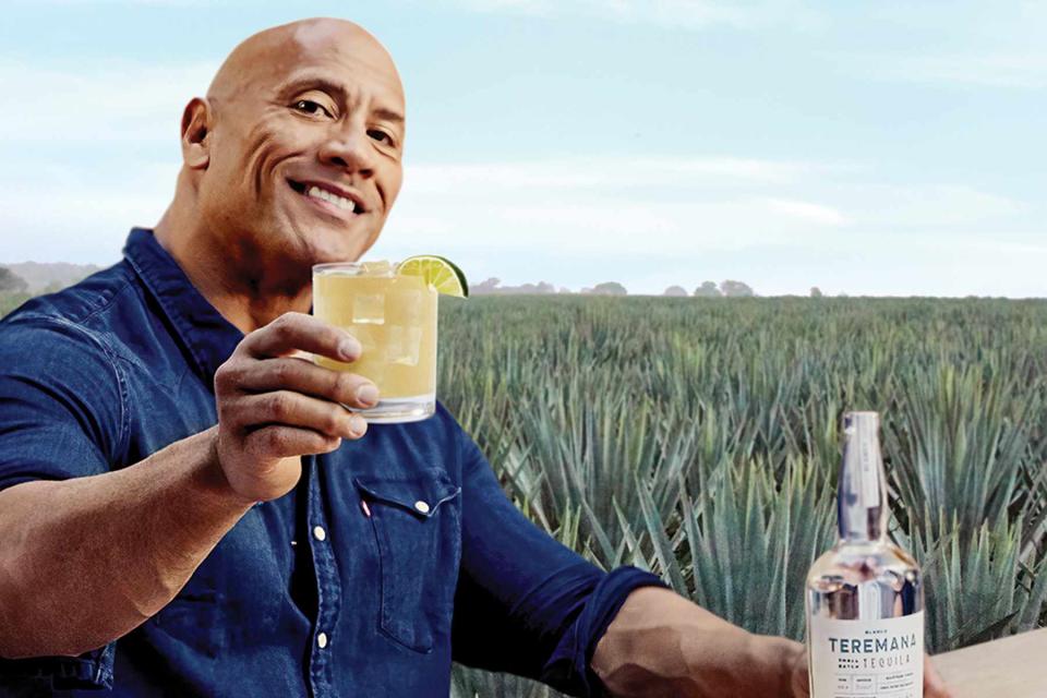 Courtesy of Teremana Dwayne Johnson with a bottle of Teremana