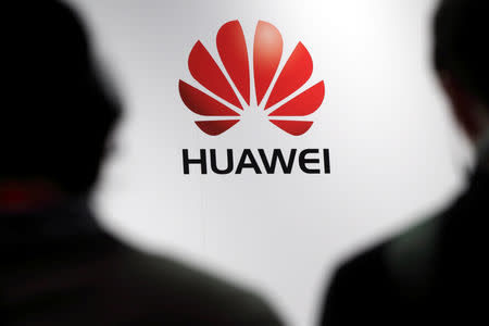 FILE PHOTO: Journalists attend the presentation of Huawei's smartphone, the Ascend P7, launched by China's Huawei Technologies in Paris, France, May 7, 2014. REUTERS/Philippe Wojazer/File Photo
