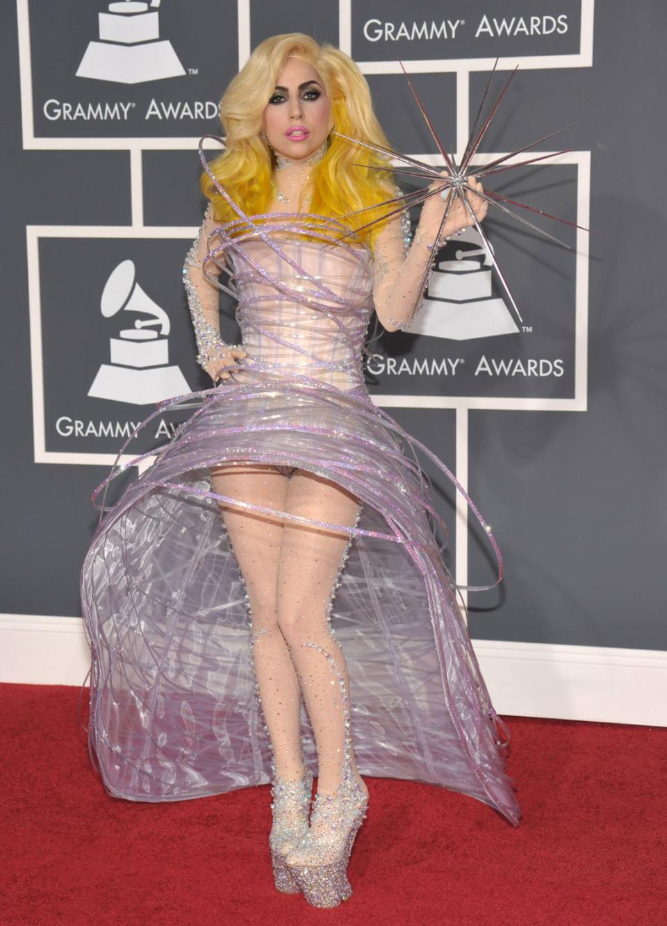 <p> Back in the day, there was no predicting what Lady Gaga would wear on the red carpet, so all of her looks - wild or tame - would come as a surprise. This galactic dress she wore to the 2010 Grammys could perhaps be considered one of her more tame looks, although this Giorgio Armani number certainly turned a lot of heads. It wasn't just the dress though - her gravity-defying shoes and very spiky prop sealed this look as one for the history books. </p>
