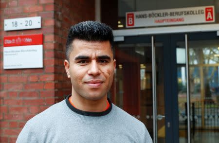 Qudratullah Hotak, a 25-year-old refugee from Afghanistan and one of 24 trainees of Ford Motor Co's so-called EQ qualification program to integrate migrants in a booming labour market, is pictured in front of his vocational training college in Cologne, Germany, January 11, 2019. Picture taken January 11, 2019. REUTERS/Wolfgang Rattay