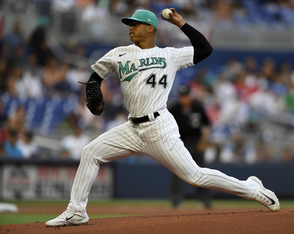 Miami Marlins starting pitcher Jesus Luzardo delivers to New York Mets' Brandon Nimmo during the first inning of a baseball game Friday, March 31, 2023, in Miami. (AP Photo/Michael Laughlin)