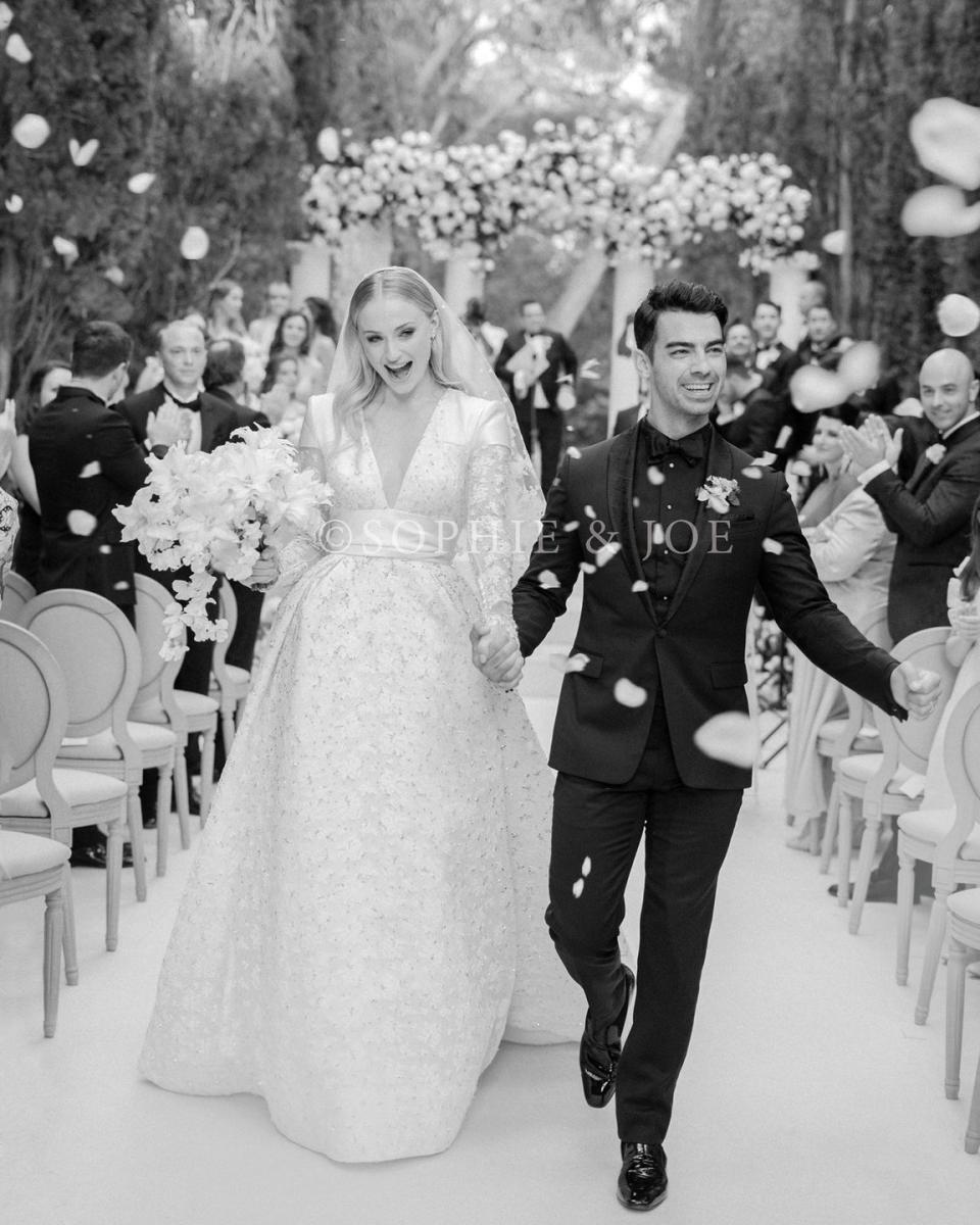 <p>Sophie Turner married Joe Jonas in the South of France wearing a custom Louis Vuitton V-neck gown designed by creative director Nicolas Ghesquière in 2019. The dress featured a cut-out back design, fitted lace sleeves, and an embellished skirt.</p>