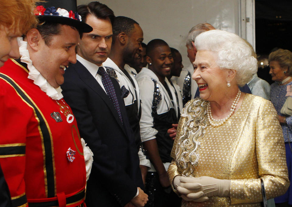 Kay meeting the Queen, as Jimmy Carr looks on. (PA)