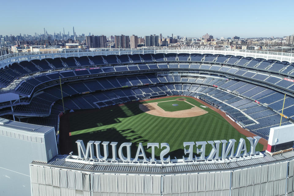 This March 26, 2020 file photo shows an empty Yankee Stadium on opening day due to COVID-19 coronavirus restrictions in the Bronx borough of New York. The Yankees and Mets would train in New York if Major League Baseball and its players try to start the coronavirus-delayed season. New York Gov. Andrew Cuomo made the announcement Saturday, June 20, 2020, and the teams confirmed the decisions. (John Woike/Samara Media via AP)