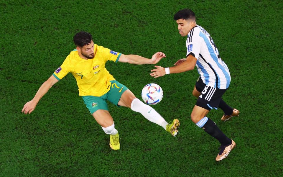 Australia's Mathew Leckie in action with Argentina's Marcos Acuna - Reuters