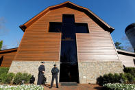 <p>Police officers stand guard in front of the Billy Graham Library before the start of the funeral for evangelist Billy Graham in Charlotte, N.C., March 2, 2018. (Photo: Jonathan Drake/Reuters) </p>