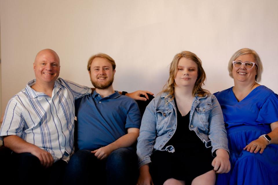 a group of people sitting together smiling