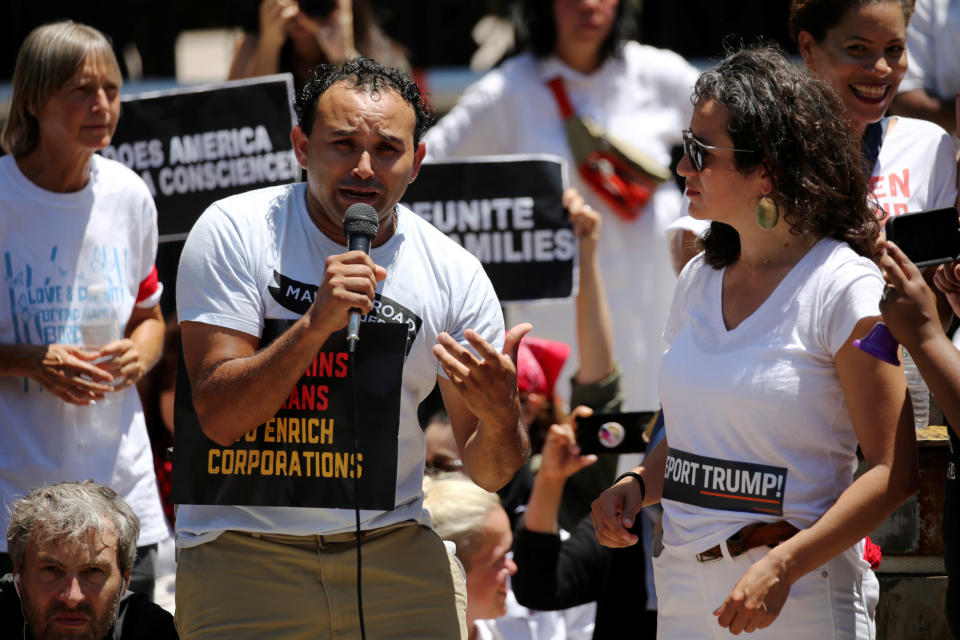 <p>An undocumented immigrant from El Salvador who gave his name as Mario weeps as he tells the story of his daughter and wife being separated and detained at the border as they attempted to join him in the U.S. to demonstrators during a rally and march calling for “an end to family detention” and in opposition to the immigration policies of the Trump administration in Washington, D.C., June 28, 2018. (Photo: Jonathan Ernst/Reuters) </p>