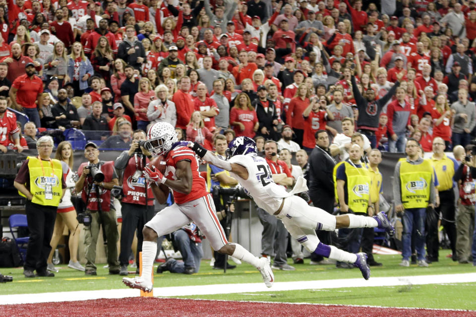 Ohio State wide receiver Terry McLaurin, left, catches a touchdown pass as Northwestern defensive back Greg Newsome II defends during the first half of the Big Ten championship NCAA college football game, Saturday, Dec. 1, 2018, in Indianapolis. (AP Photo/AJ Mast)