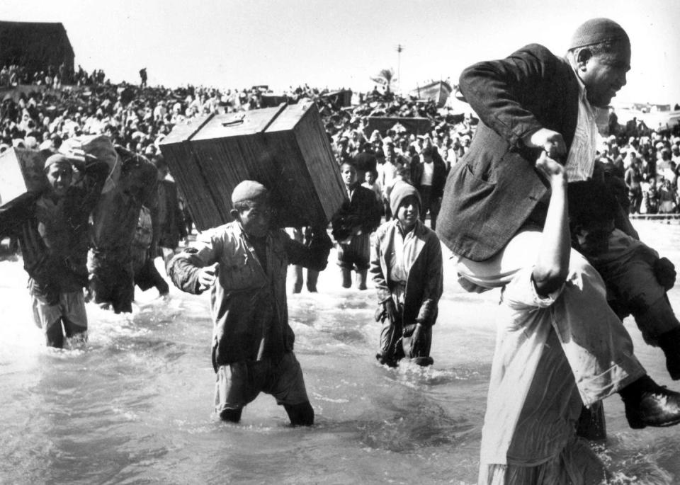 Palestinians flee their homes during the 1948 Arab-Israeli war. <a href="https://www.gettyimages.com/detail/news-photo/the-1948-palestinian-exodus-known-in-arabic-as-the-nakba-news-photo/1354487454?adppopup=true" rel="nofollow noopener" target="_blank" data-ylk="slk:Pictures from History/Universal Images Group via Getty Images;elm:context_link;itc:0;sec:content-canvas" class="link ">Pictures from History/Universal Images Group via Getty Images</a>