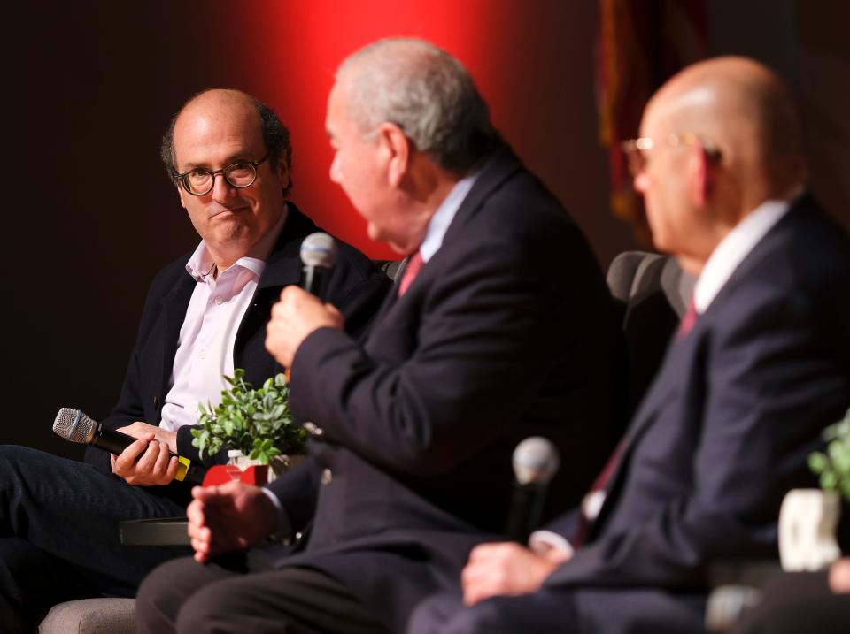 David Grann, left, listens to Osage Principal Chief Geoffrey Standing Bear during an Oct. 17 panel discussion. On the right is Chickasaw Governor Bill Anoatubby.