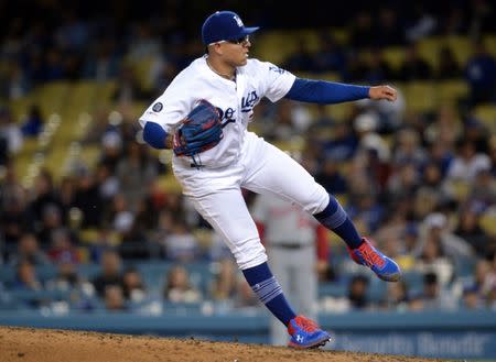 FILE PHOTO: May 10, 2019; Los Angeles, CA, USA; Los Angeles Dodgers relief pitcher Julio Urias (7) throws against the Washington Nationals during the ninth inning at Dodger Stadium. Mandatory Credit: Gary A. Vasquez-USA TODAY Sports
