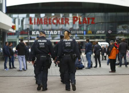 Police walks towards the Limbecker Platz shopping mall in Essen, Germany, March 11, 2017, after it was shut due to attack threat. REUTERS/Thilo Schmuelgen