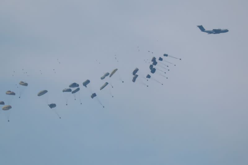 An airplane drops aid over Gaza