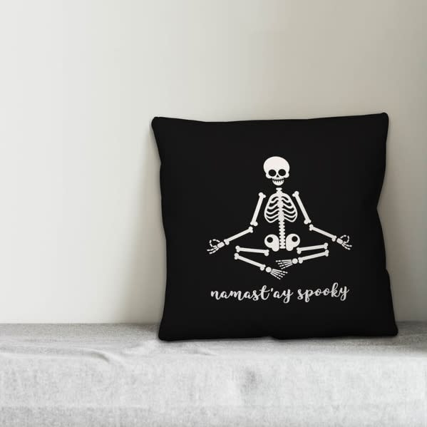 Stiefel Namastay Skeleton Throw Pillow (Image via Wayfair)