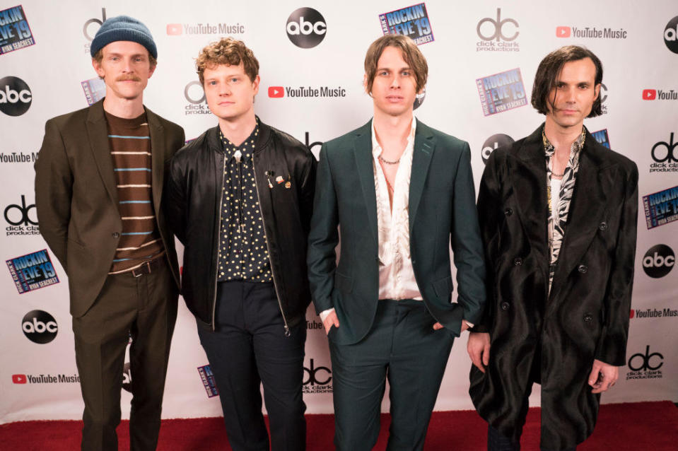 Photo of Foster the People on a music award show red carpet  