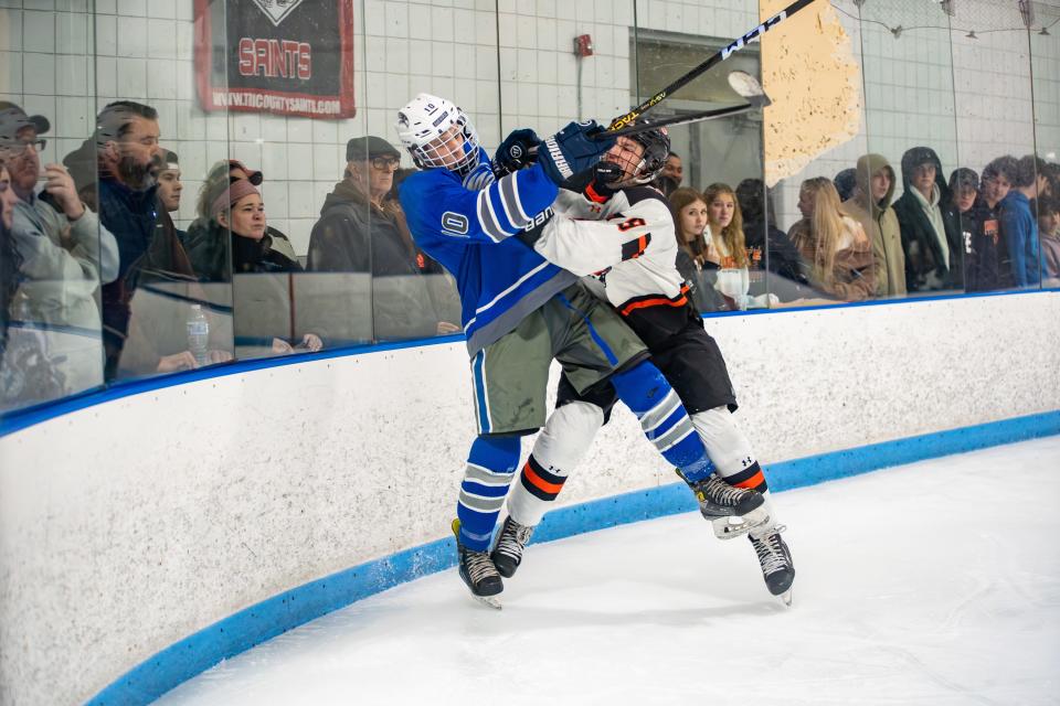 Taunton's Jamie Valarelli checks Southeastern/Bristol-Plymouth's Landon Pearson during an MIAA Division 3 Preliminary Round game.